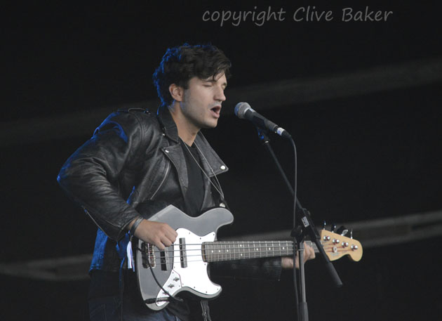 Lead singer playing guitar